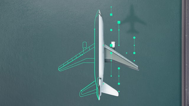 A top-down view of an airplane on a dark blue surface, with green digital outlines and data points suggesting analytics or design.