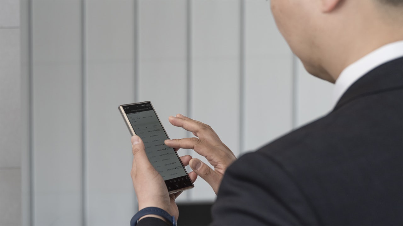 Man looks at tablet