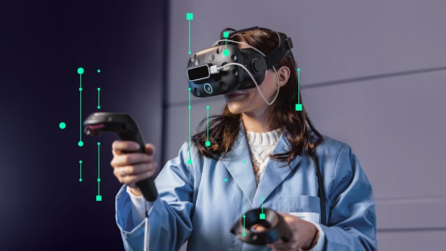 A woman in a lab coat wears a VR headset and holds controllers, with green data visualisation overlays, indicating virtual reality interaction.