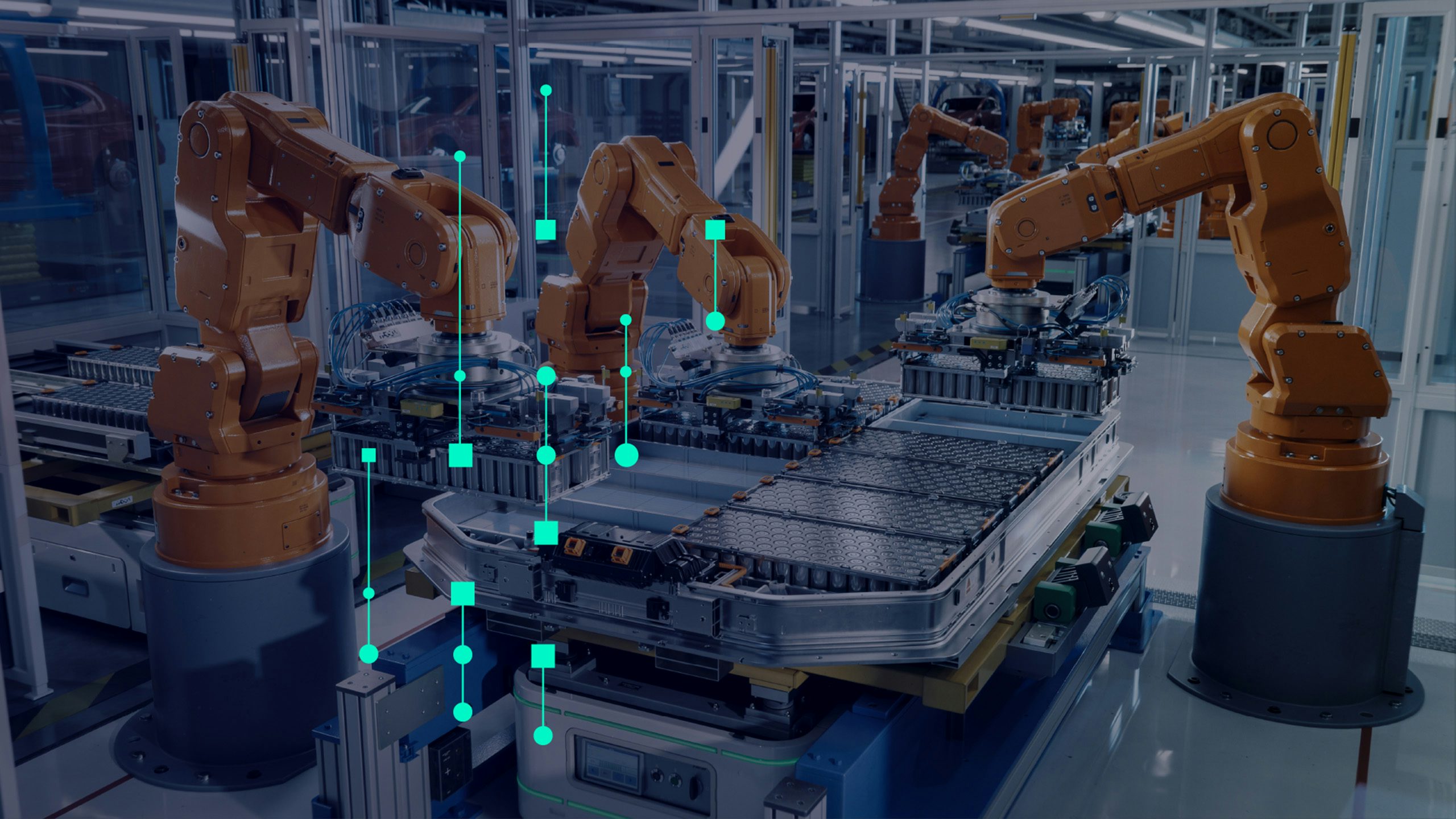 A workstation in an automotive industry setting with a person working on a vehicle.
