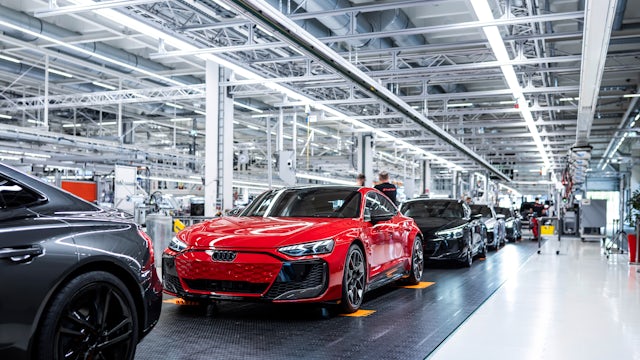 Finished Audis rolling off the assembly line.