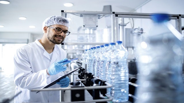 bottles being inspected on a production line.
