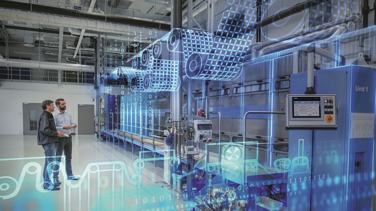 Two men stand in a factory setting with industrial machinery, overlaid with blue digital graphics and data streams.