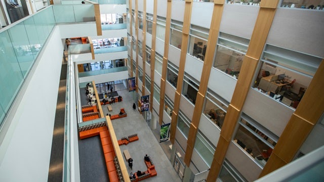 Interior view of a colourful educational building (University of Toronto Scarborough Campus) with a large atrium.