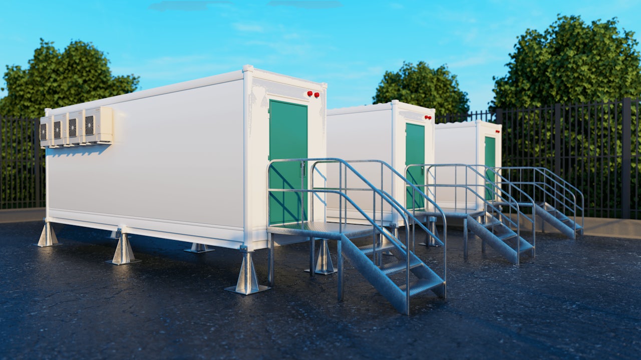 A Siemens battery storage system with multiple battery modules arranged in a row.