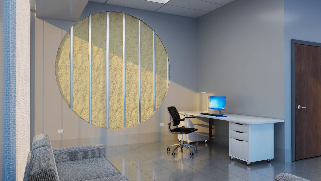 The office showing exposed insulation: Office with a circular cutaway revealing wall insulation, a desk with a computer, and a sofa.