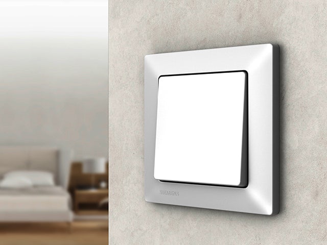A promotional image for Delta Line I System switches and sockets, showcasing a clean and modern design.
