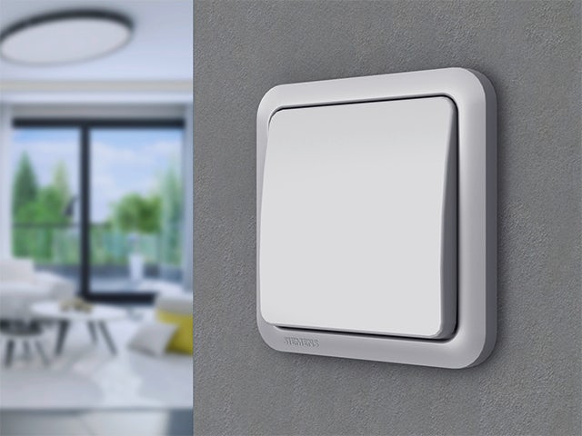 A promotional image for Delta Profil switch and socket program with a white background and a product image in the center.