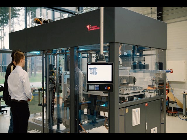 Engineers from Tonrud Engineering observing their packaging machine. 