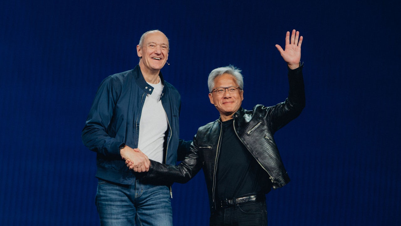Roland Busch, CEO Siemens, and Jensen Huang, CEO NVDIA, shaking hands at CES 2026