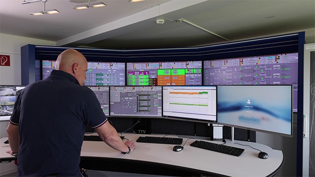 Man looking at sewage treatment dashboards.