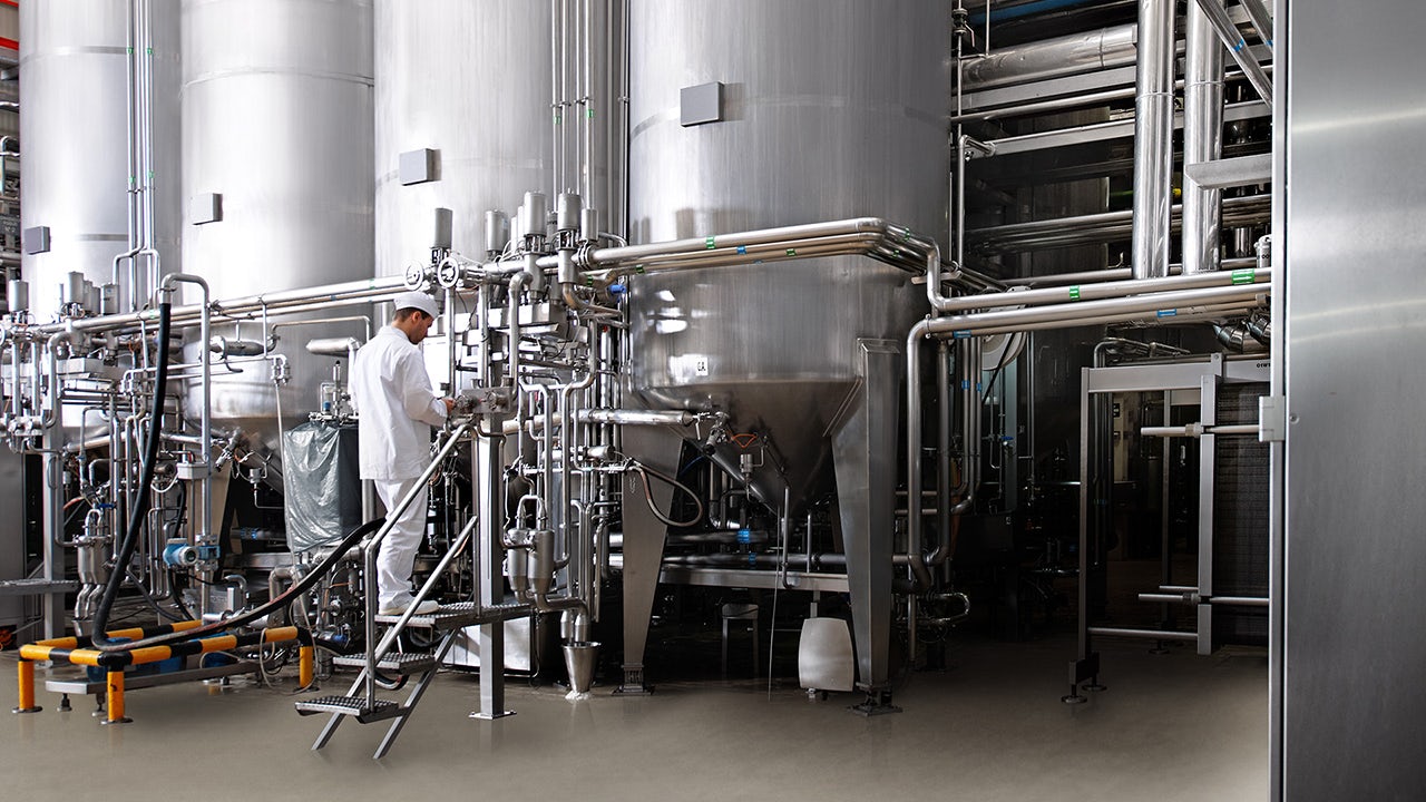 An image showing a dairy farm with a focus on energy efficiency and waste heat strategies.