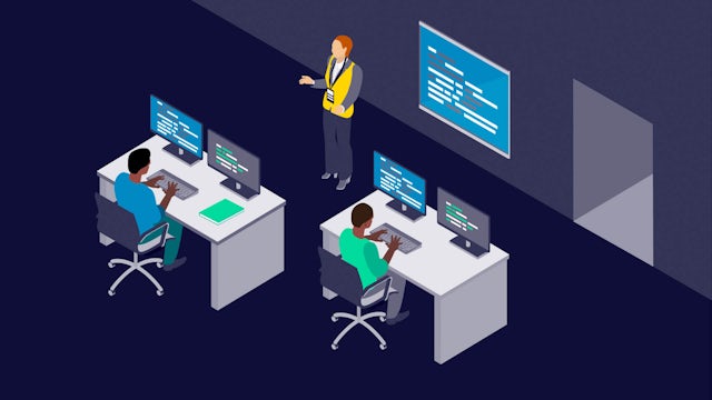 Stylized icon of a teacher at the front of a class with students at desks with two monitors.