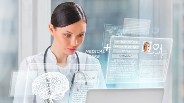 Female doctor scanning brain of patient with help of modern technology