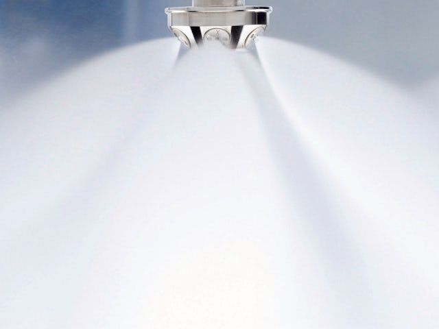 A high-pressure water mist nozzle spraying a water curtain. 