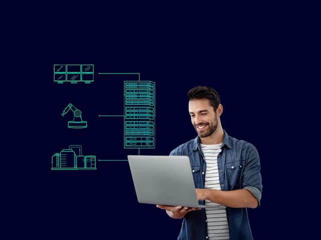 A smiling man uses a laptop, with green outlined icons of industrial elements (server racks, robot arm, factory) connected to a central server.
