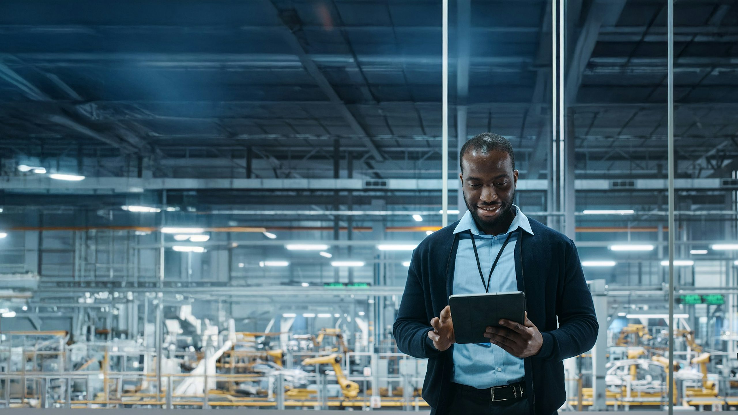 A digital illustration of a factory with machinery and digital screens, showcasing industrial digitalization services.