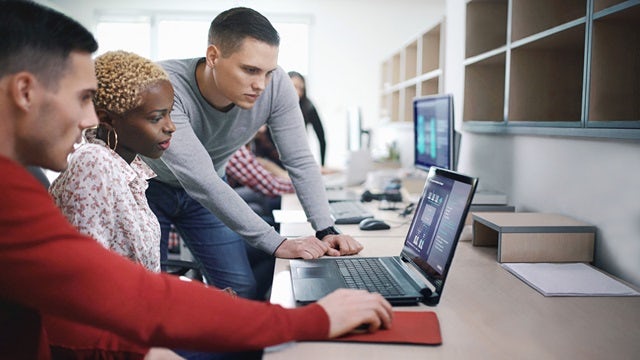 Team working together with IT/OT integration.