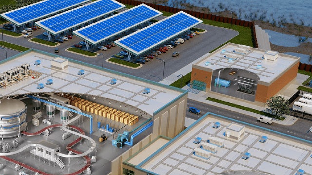 3D model of a manufacturing facility with buildings, equipment, and vehicles viewed from above.