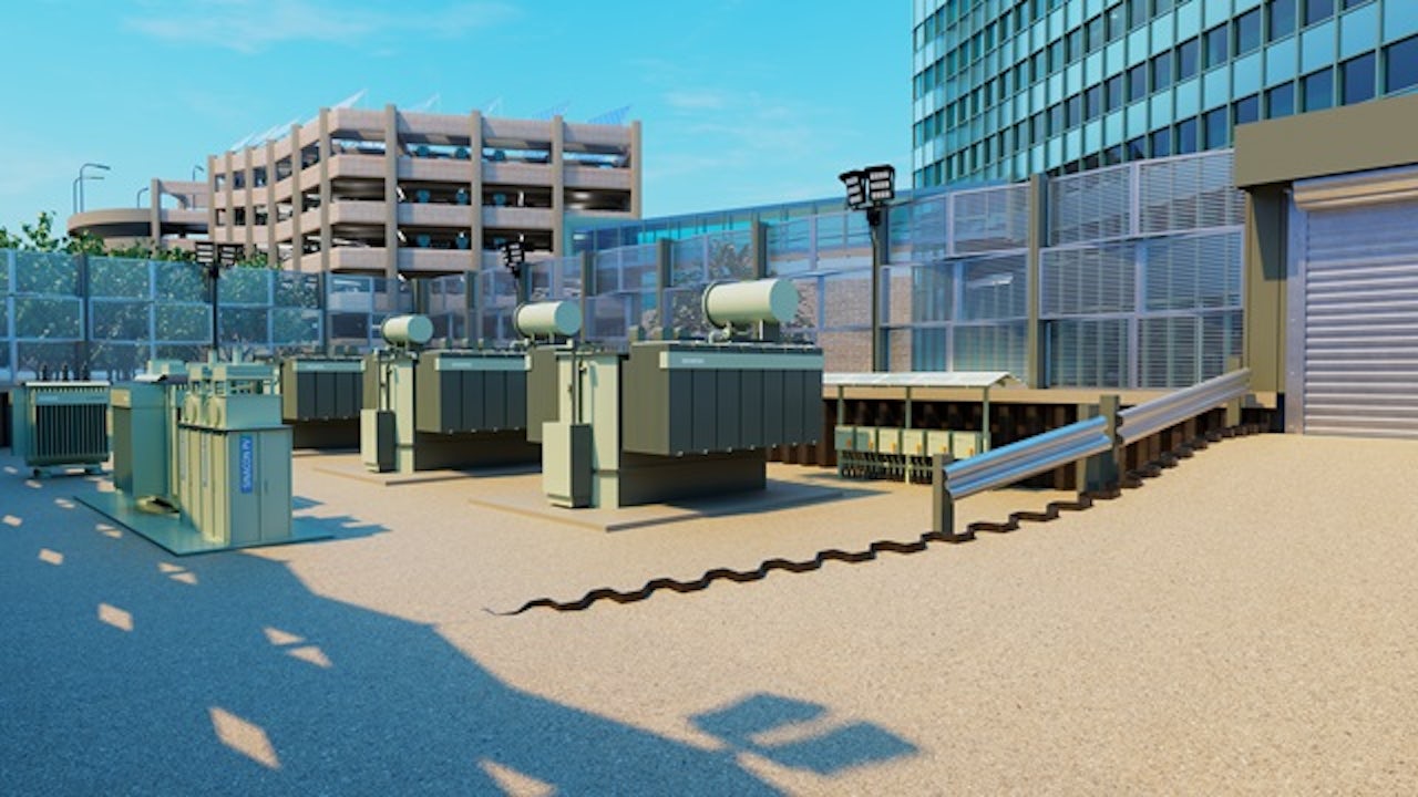 Solar panels installed on a commercial building roof with a city skyline in the background.