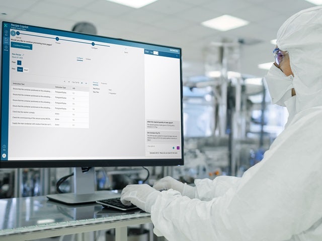 Modern pharmaceutical factory with clean design and worker in white lab coat representing smart manufacturing technology.