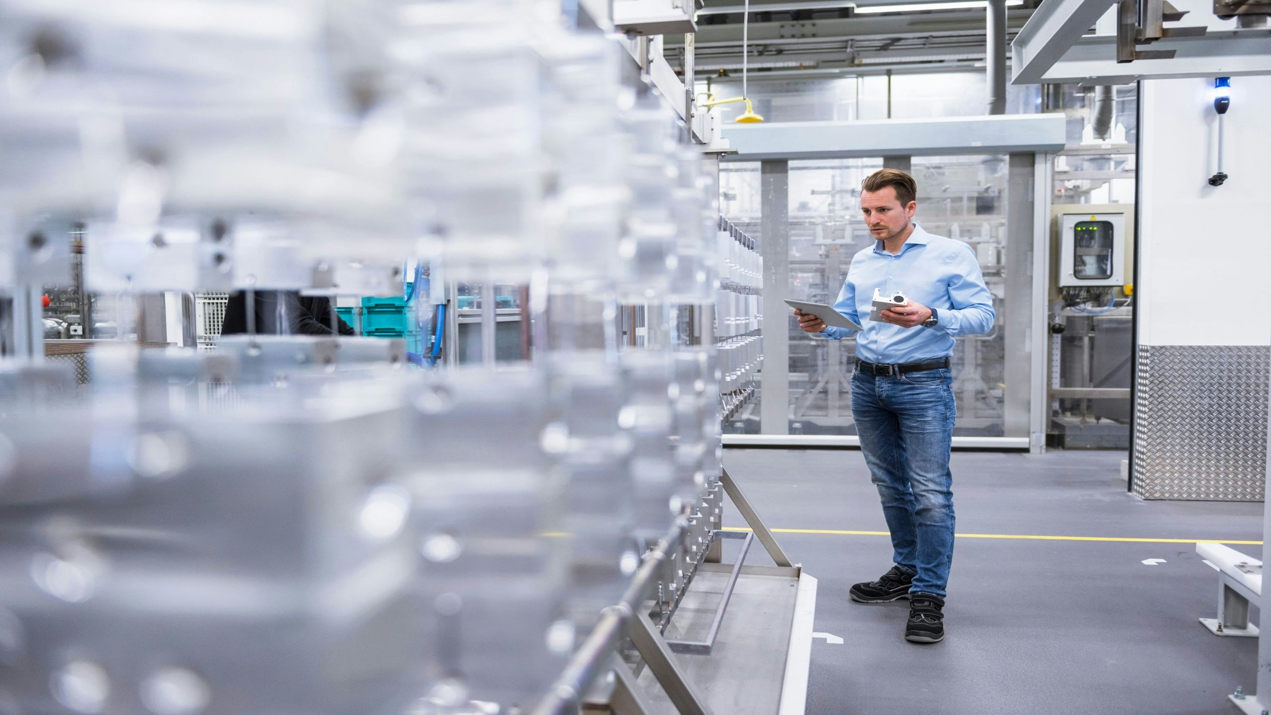 Person working in smart manufacturing facility.