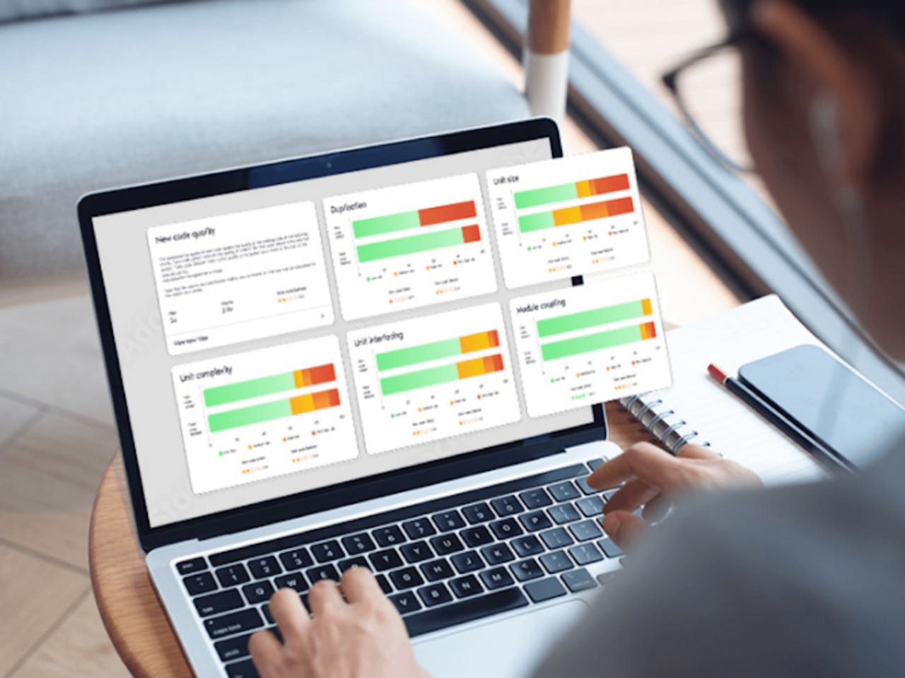 Person viewing data visualizations on laptop