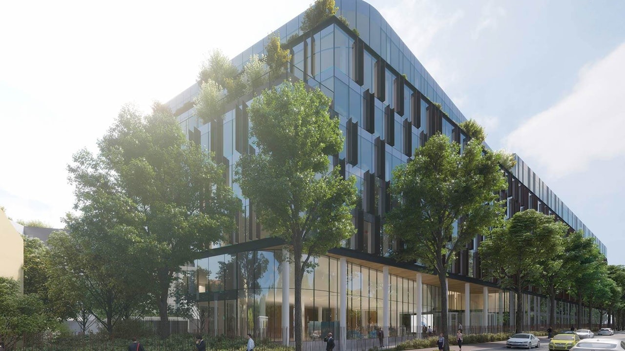 An office building surrounded by trees.