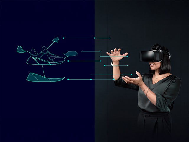 A digital twin of a shoe is displayed in a virtual reality environment.