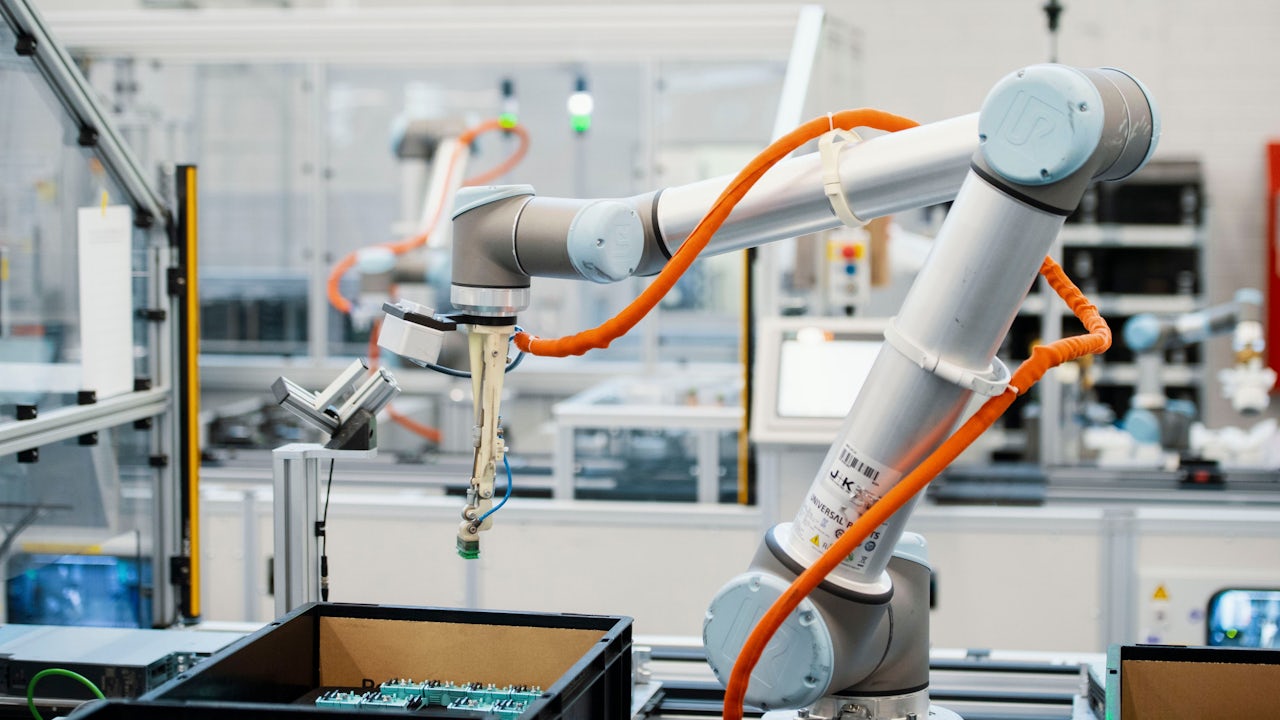 A manufacturing cell that contains robots enabled by AI to pick and place parts.