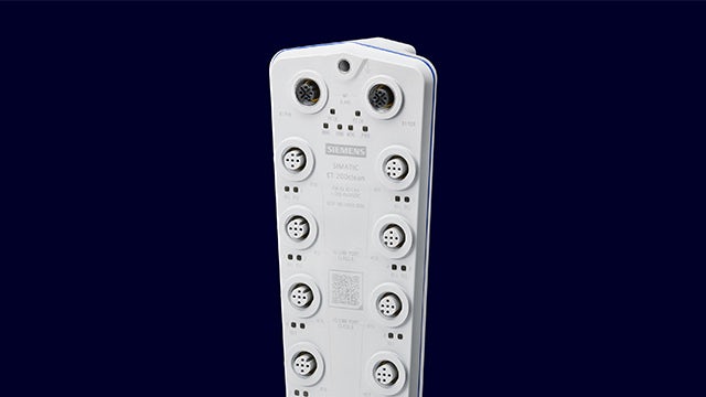 Industrial control panel with blue buttons and digital display on stainless steel surface