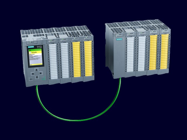 A promotional image of a Simatic ET 200MP industrial control system with a sleek design and a focus on its features.