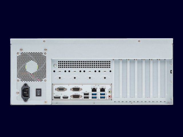 A back view of a Simatic Rack PC with a red and white label on the back.