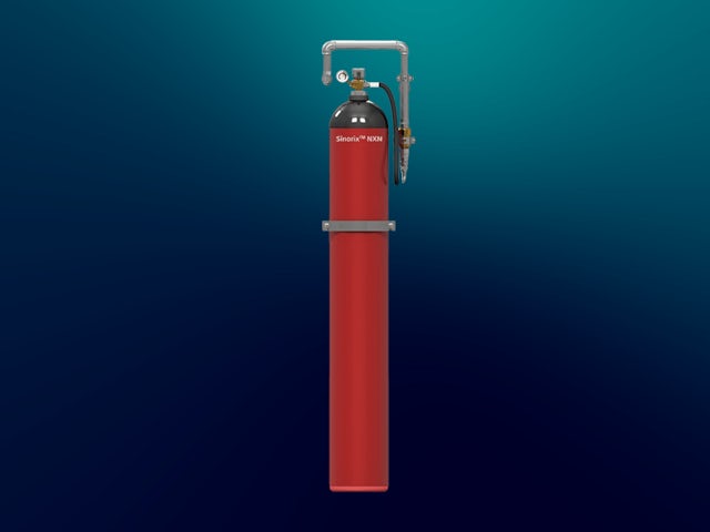 A red fire suppression cylinder labeled "Sinorix 1230" with a pressure gauge and piping connected to its top, set against a dark blue background.