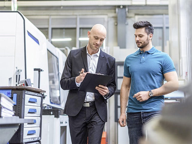 A promotional image for a Sinumerik optimization check product featuring a machine with a screen displaying a graph.