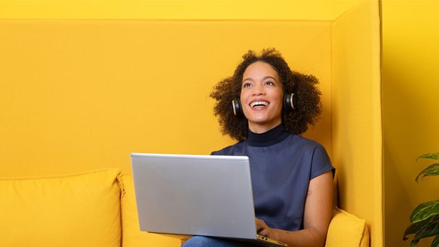 A promotional image for a course featuring a person in a classroom setting with a laptop and books.