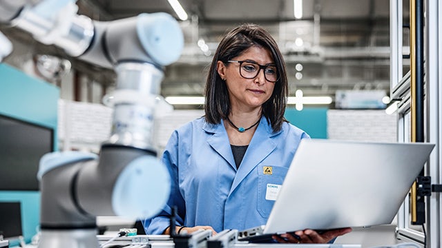 Woman working on a computer.