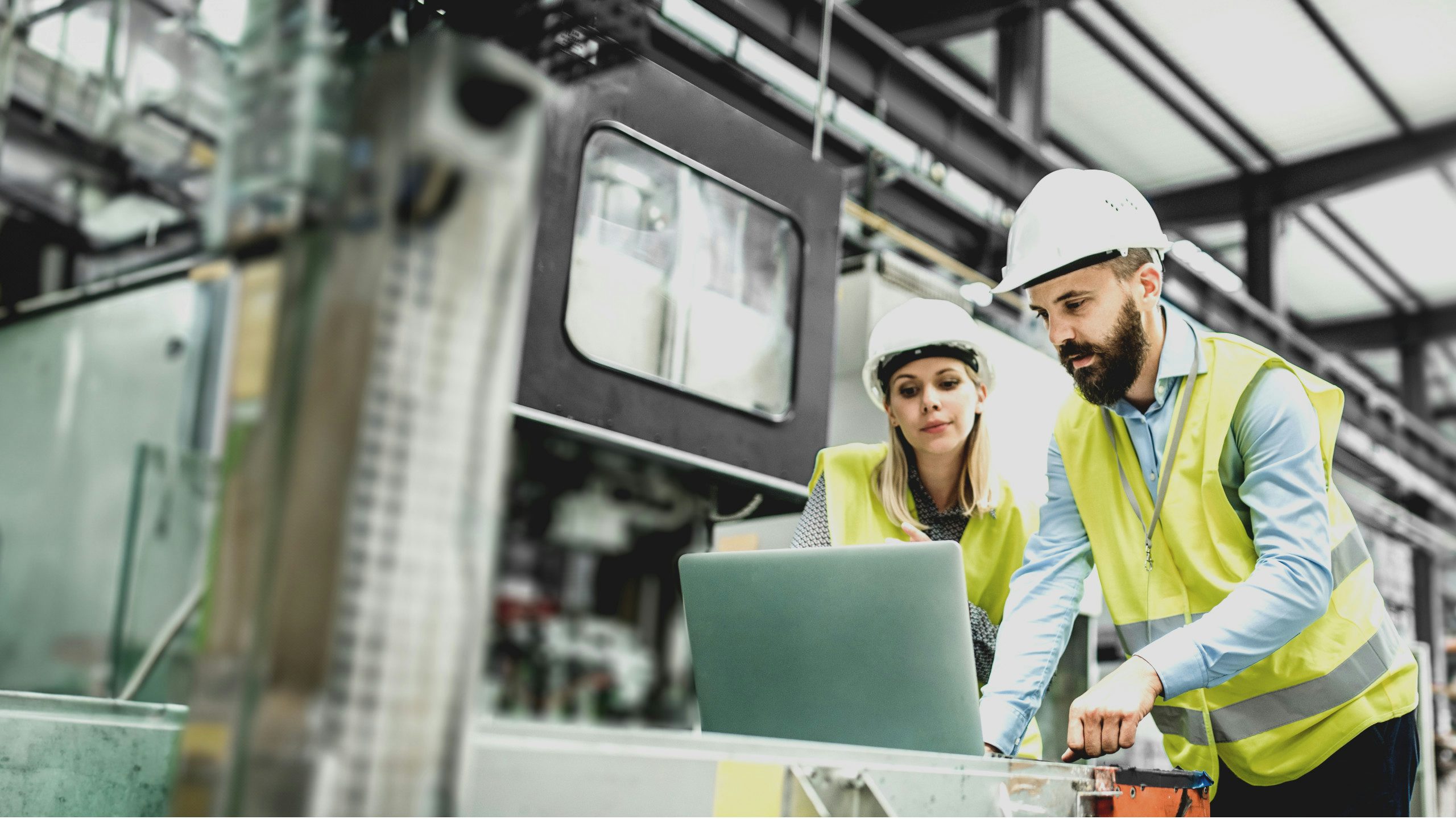 Two team members working a computer.