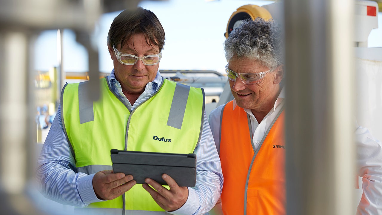 Digital transformation in specialty fine chemicals with scientist analyzing data on a high-tech interface