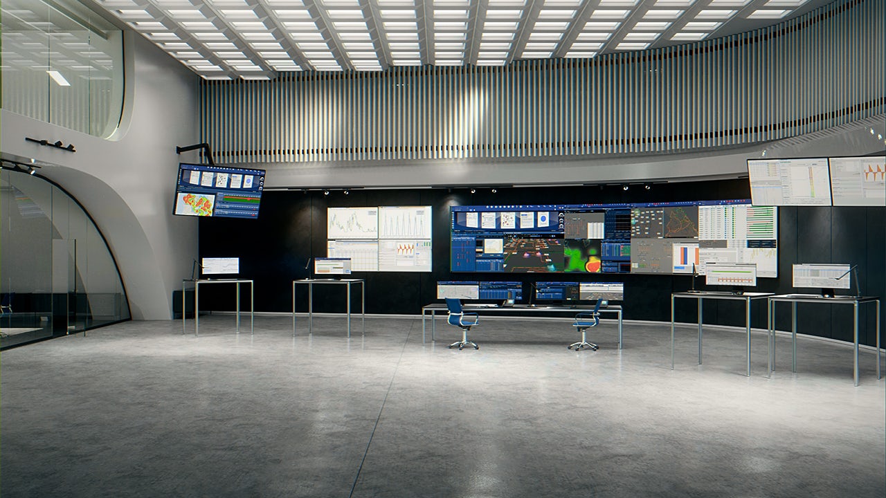 A control center for a power management system with various screens and displays showing real-time data and system status.