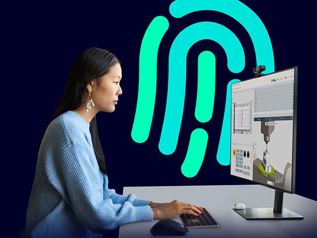 Side view of a woman at a computer, the background is a dark blue wall with a fingerprint icon representing security. 