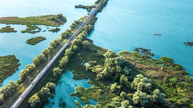 Train-route-lake-birdview-1350925993-bright