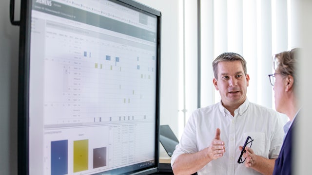 Two men discussing a presentation