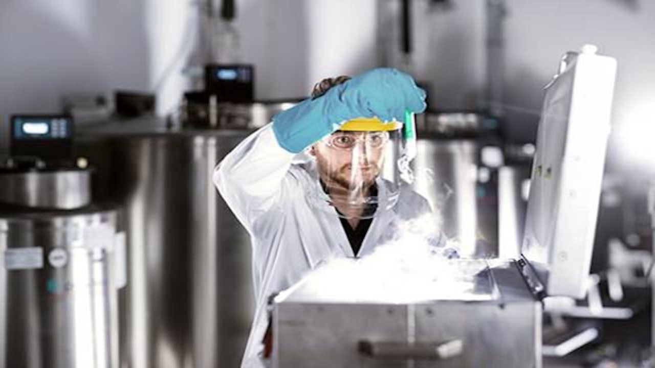 A webinar poster for life sciences featuring a person in a lab coat and a microscope.