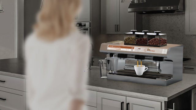 A woman is standing in front of a coffee machine, possibly preparing coffee.