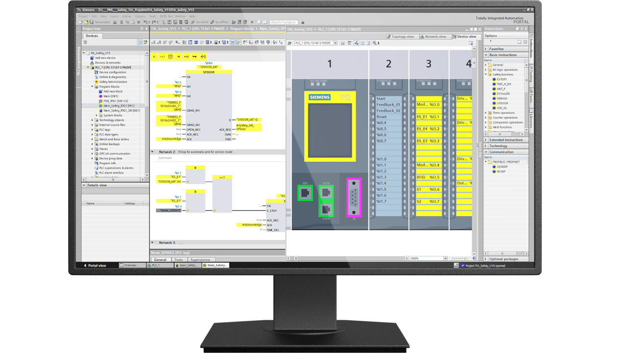 Monitor displaying Siemens TIA Portal with PLC programming and safety configuration interface.